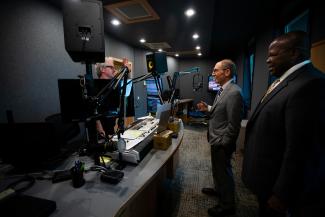 President Capilouto and others stand inside recording room at WUKY