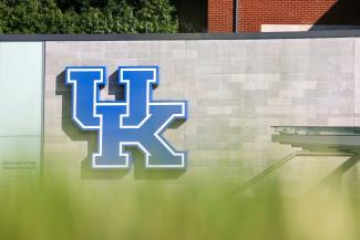 Photo of University of Kentucky logo on stone wall on campus